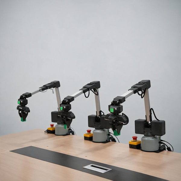 Three robotic arms together clamp building blocks